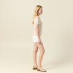 D&eacute;bardeur tricot sans manches creme femme