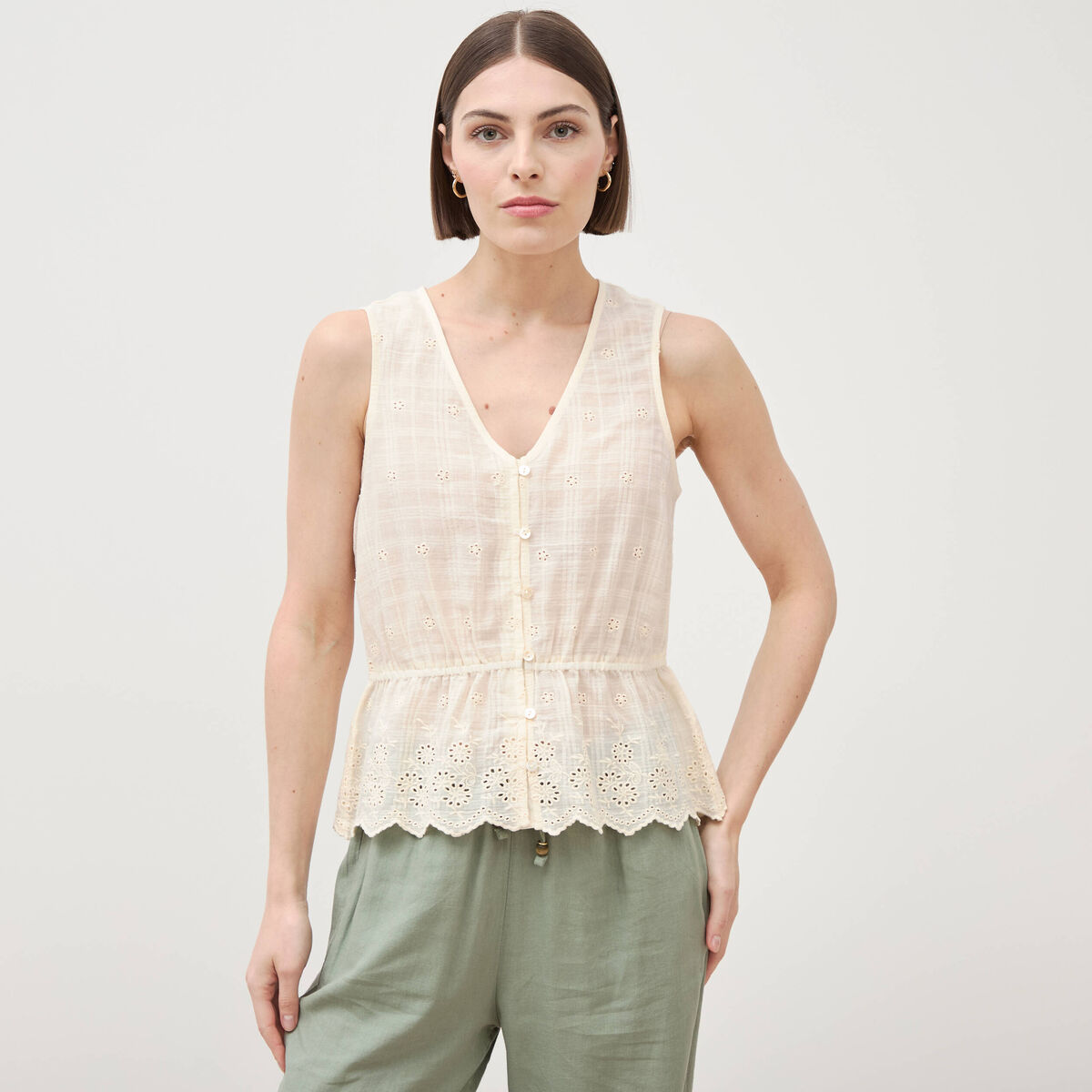 Top col v sans manches en coton creme femme