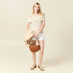 D&eacute;bardeur tricot sans manches creme femme