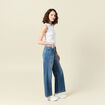 Polo sans manches blanc femme