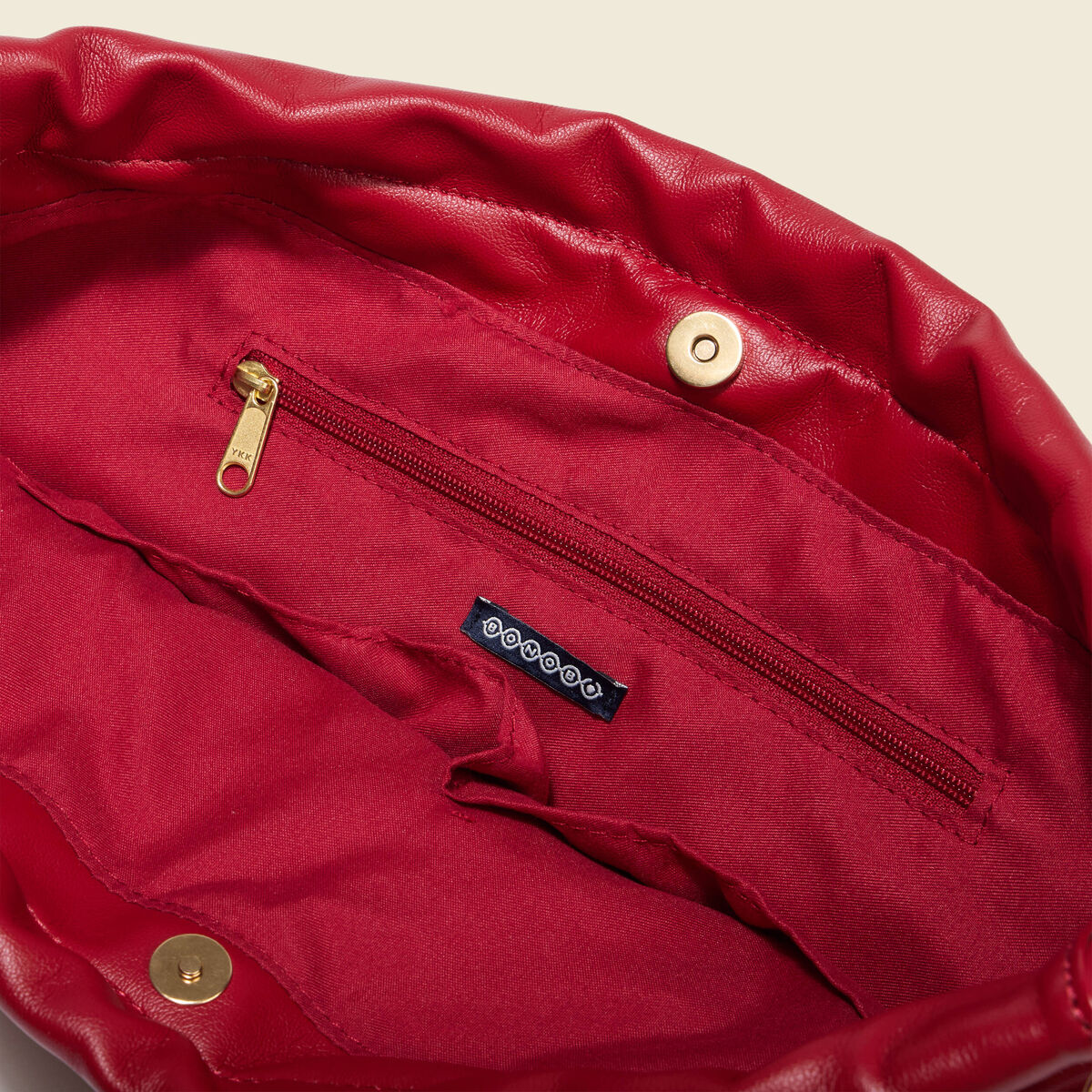 Sac bandouli&egrave;re avec doublure rouge femme