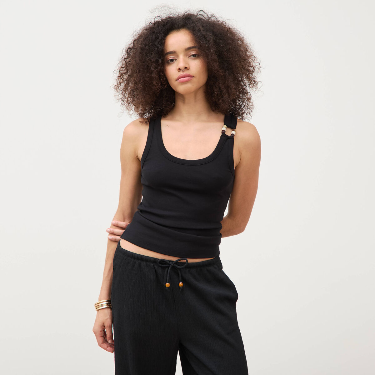 D&eacute;bardeur sans manches noir femme