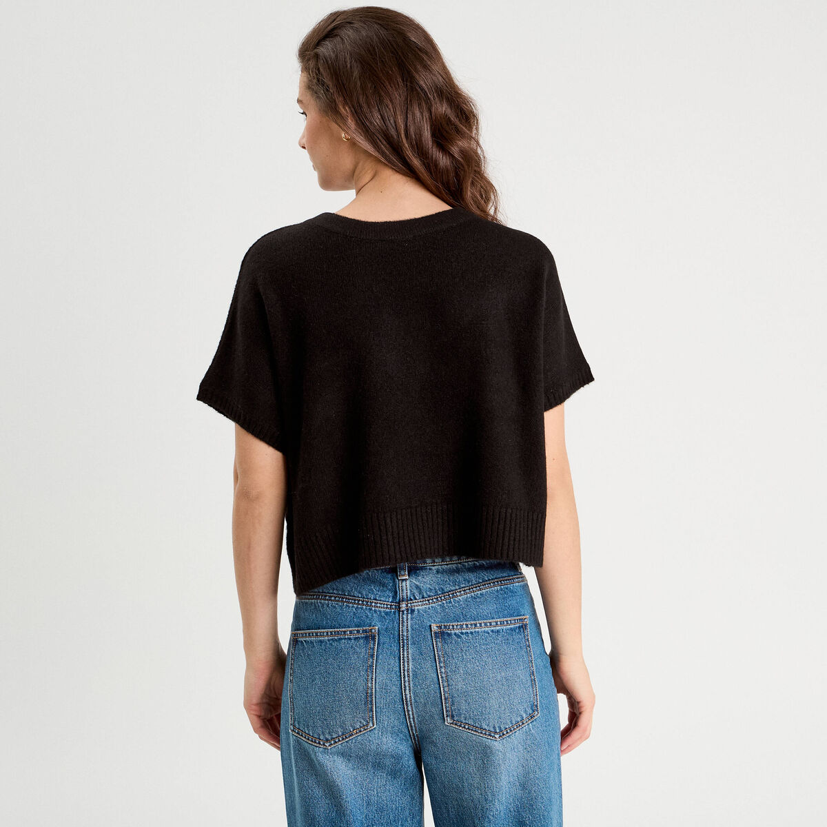 Pull dos devant détail noeud noir femme