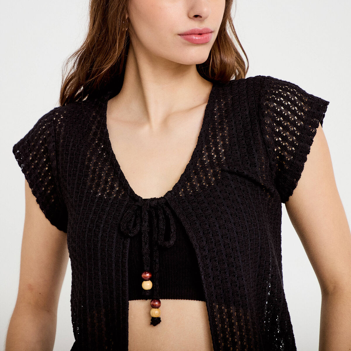 Gilet manches courtes aspect dentelle noir femme
