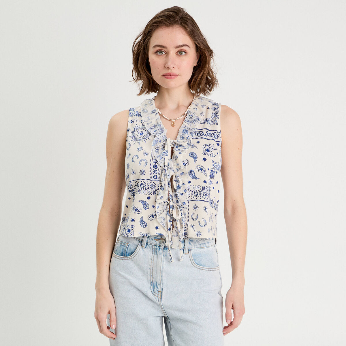 Blouse nouée sans manches blanc femme