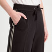 Pantalon large style jogging noir femme