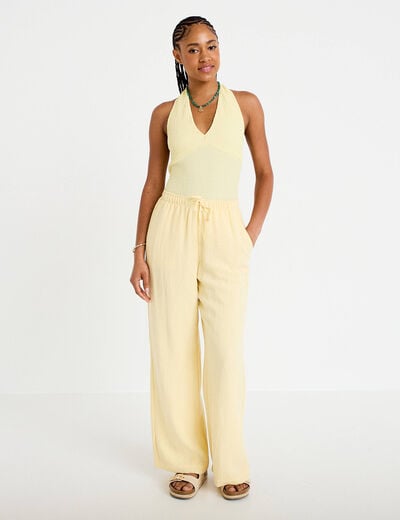 Top cintr&eacute; sans manches avec relief jaune pastel femme