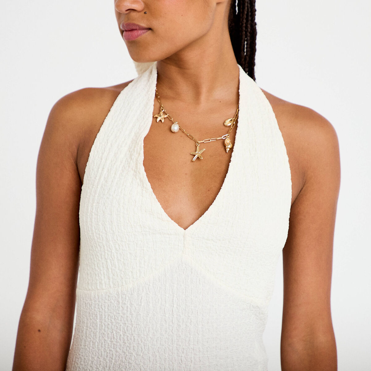 Top cintr&eacute; sans manches avec relief ecru femme