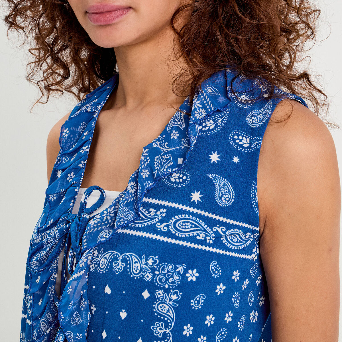 Blouse nouée sans manches bleu femme