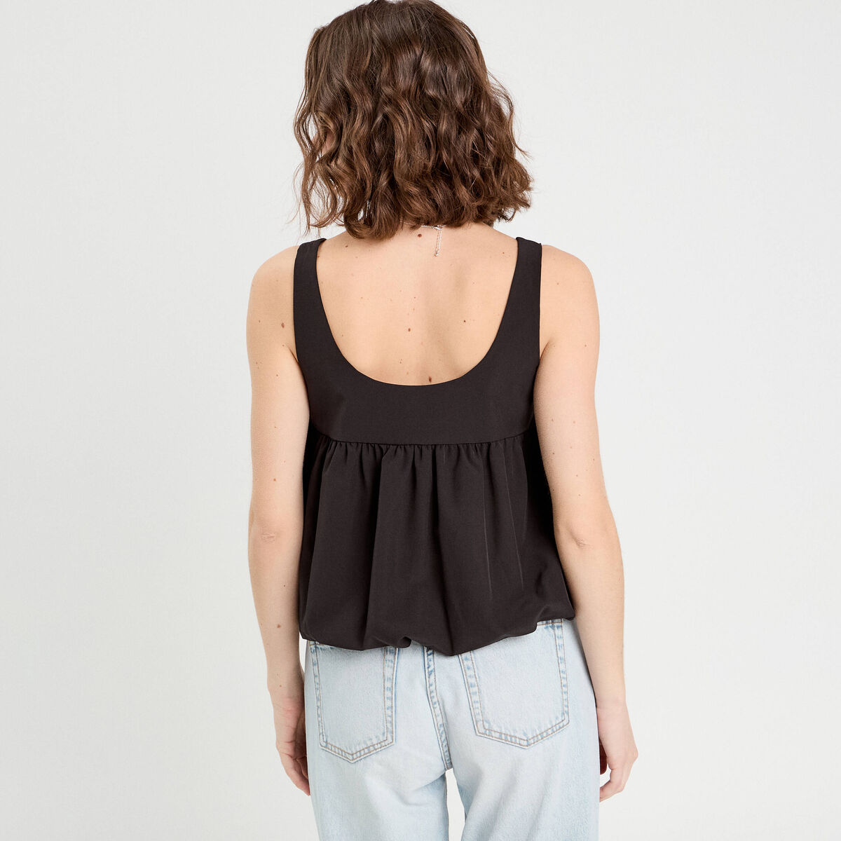 Blouse effet boule et noeud noir femme