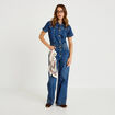 Combinaison jean flare col am&eacute;ricain denim stone femme