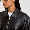 Veste effet boule manches longues noir femme