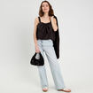 Blouse effet boule et noeud noir femme