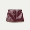 Jupe-short en similicuir bordeaux
