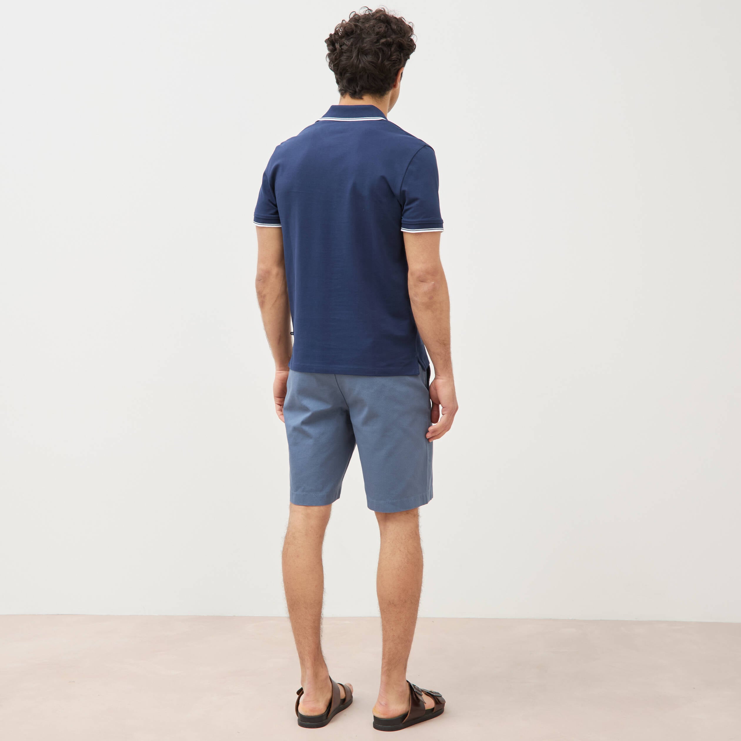 Polo cintr&eacute; en coton manches courtes bleu marine homme