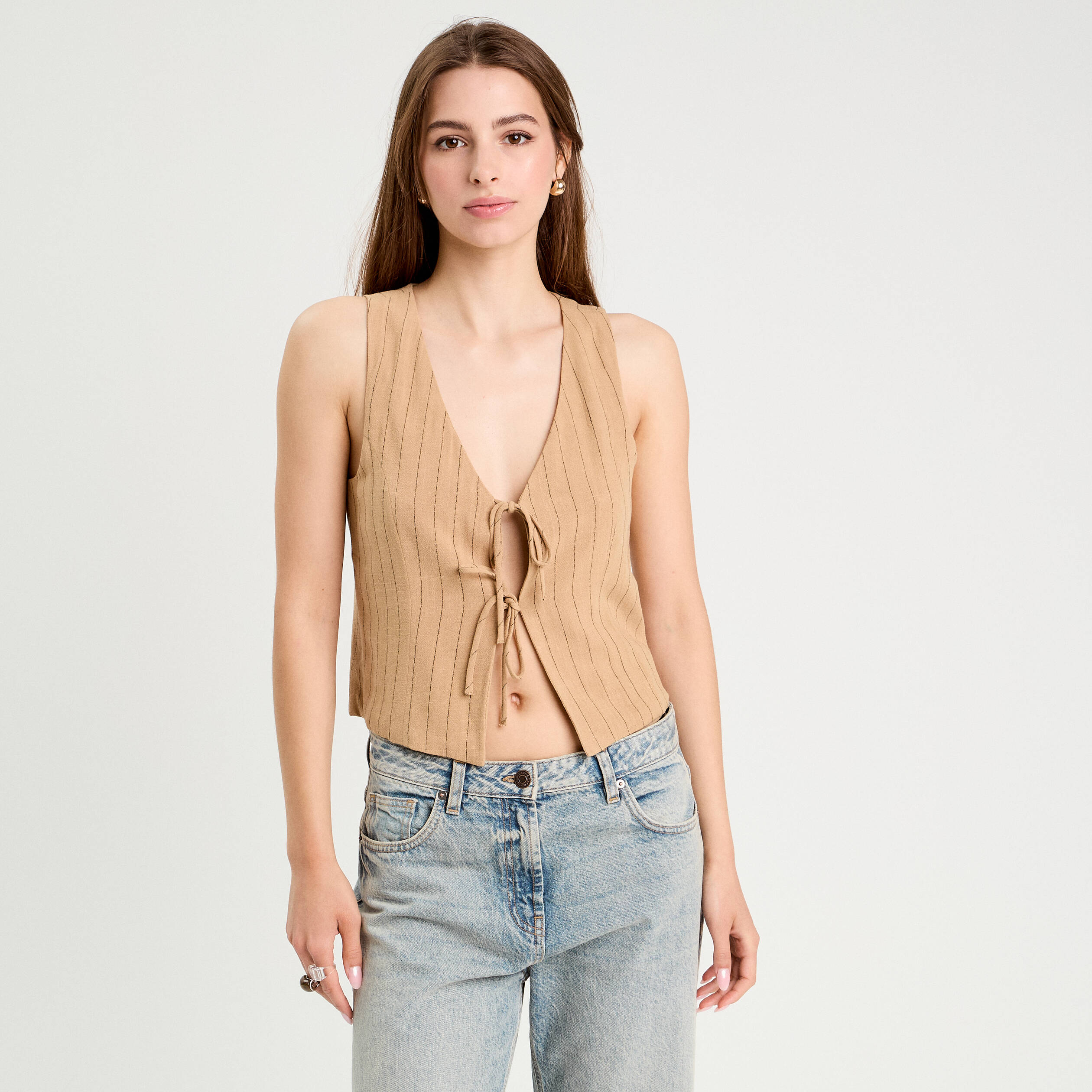 veston sans manches noue beige femme Veston sans manches noué beige femme