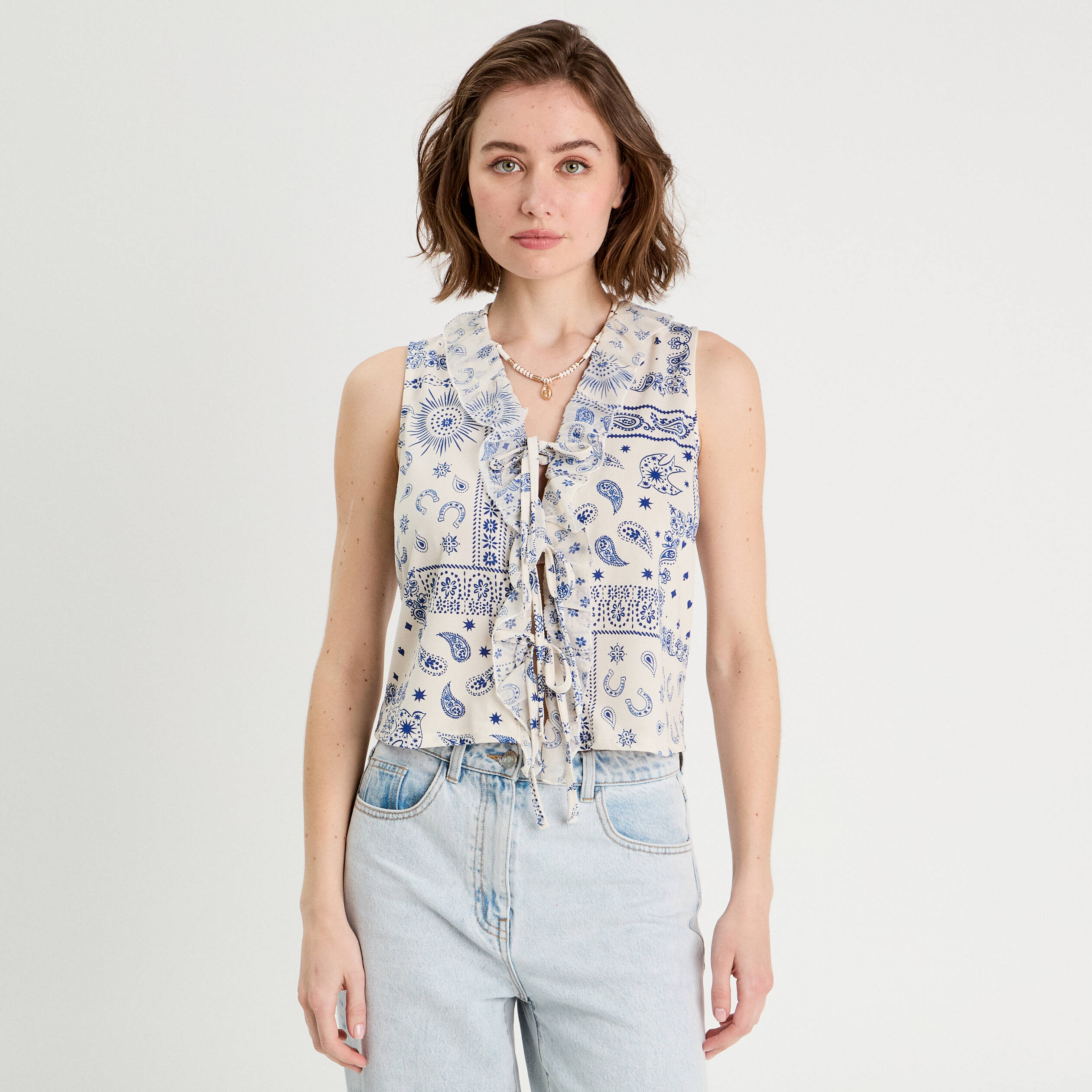 Blouse nou&eacute;e sans manches blanc femme