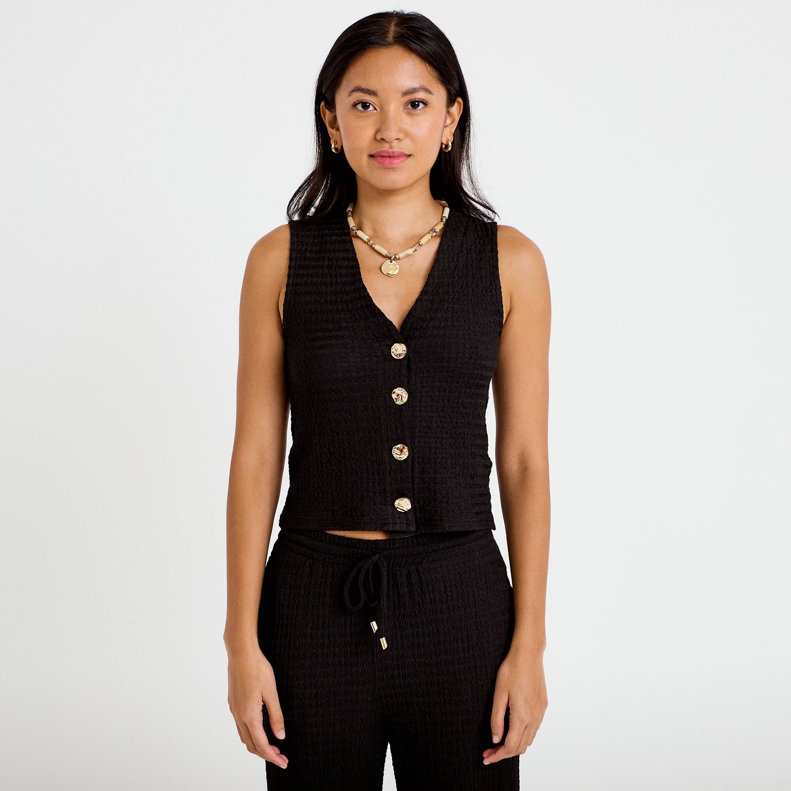 Gilet cintr&eacute; sans manches col v noir femme