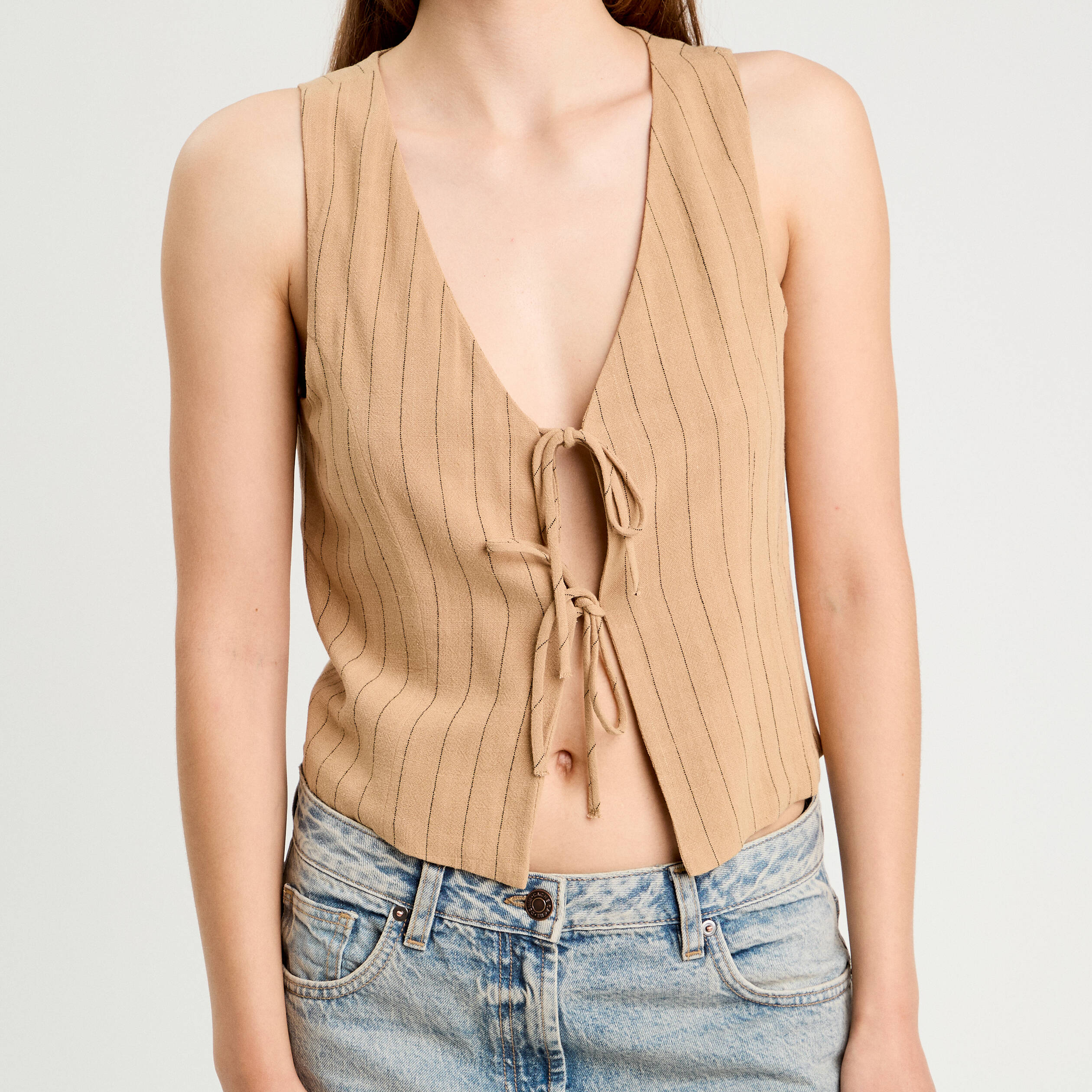 veston sans manches noue beige femme Veston sans manches noué beige femme