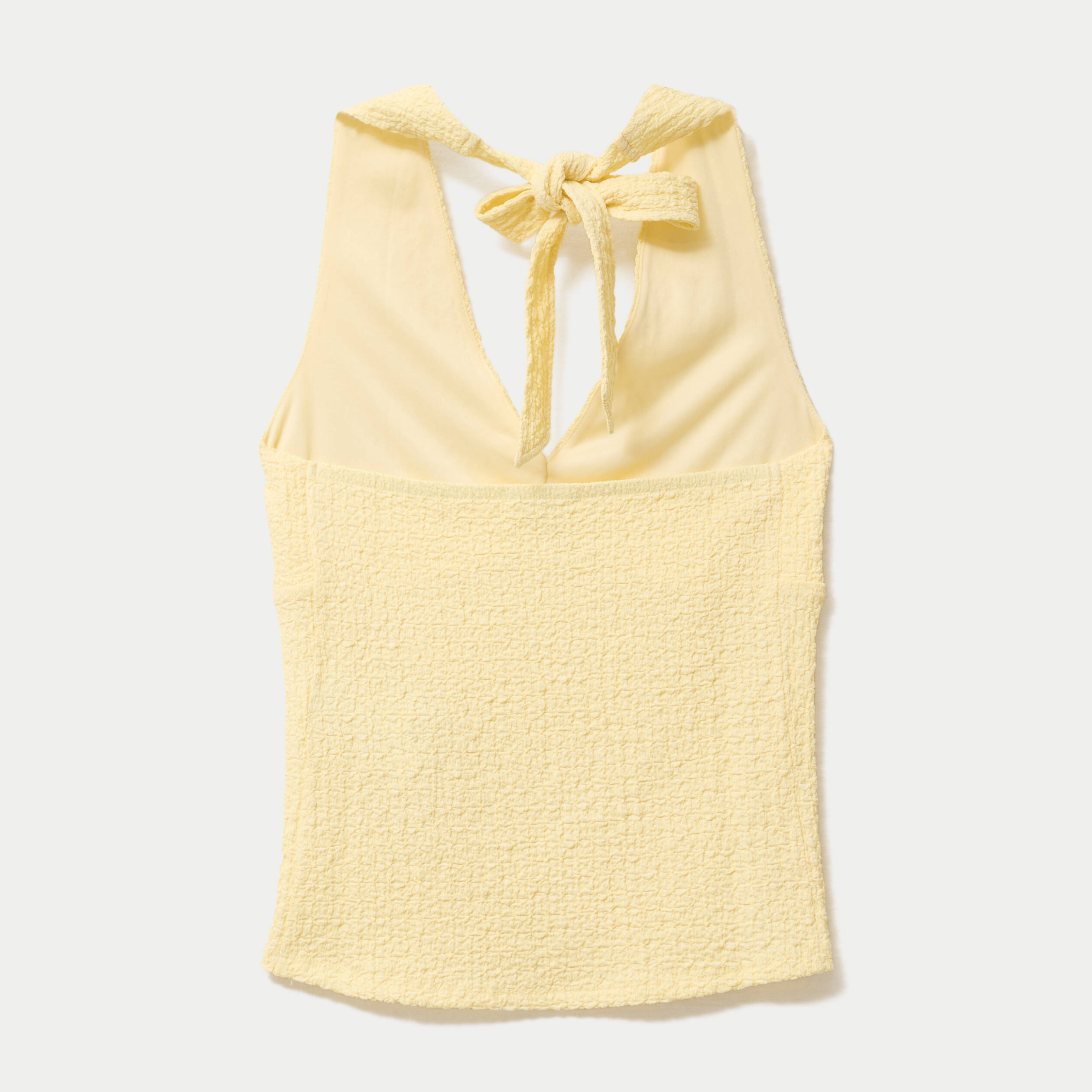 Top cintr&eacute; sans manches avec relief jaune pastel femme