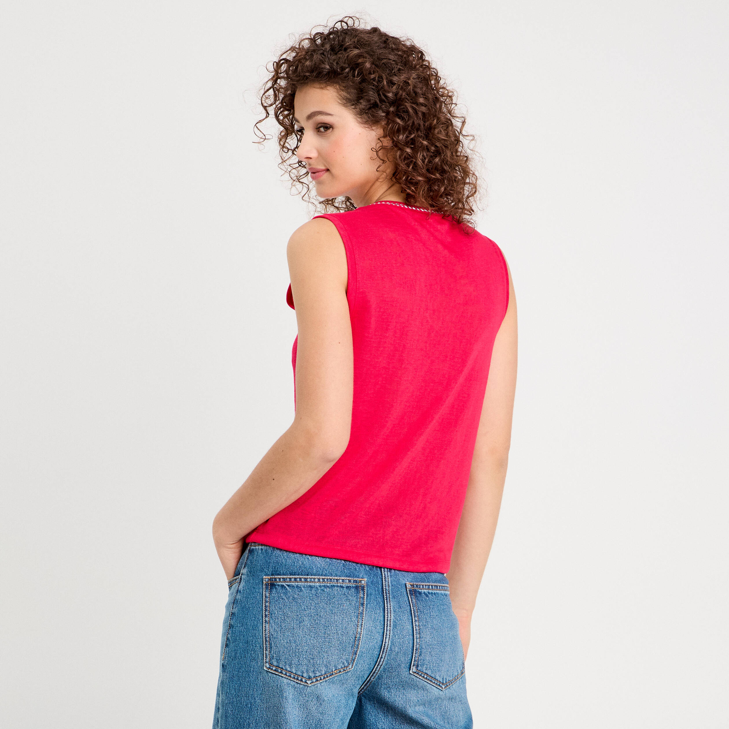 D&eacute;bardeur d&eacute;tail noeud rose vif femme