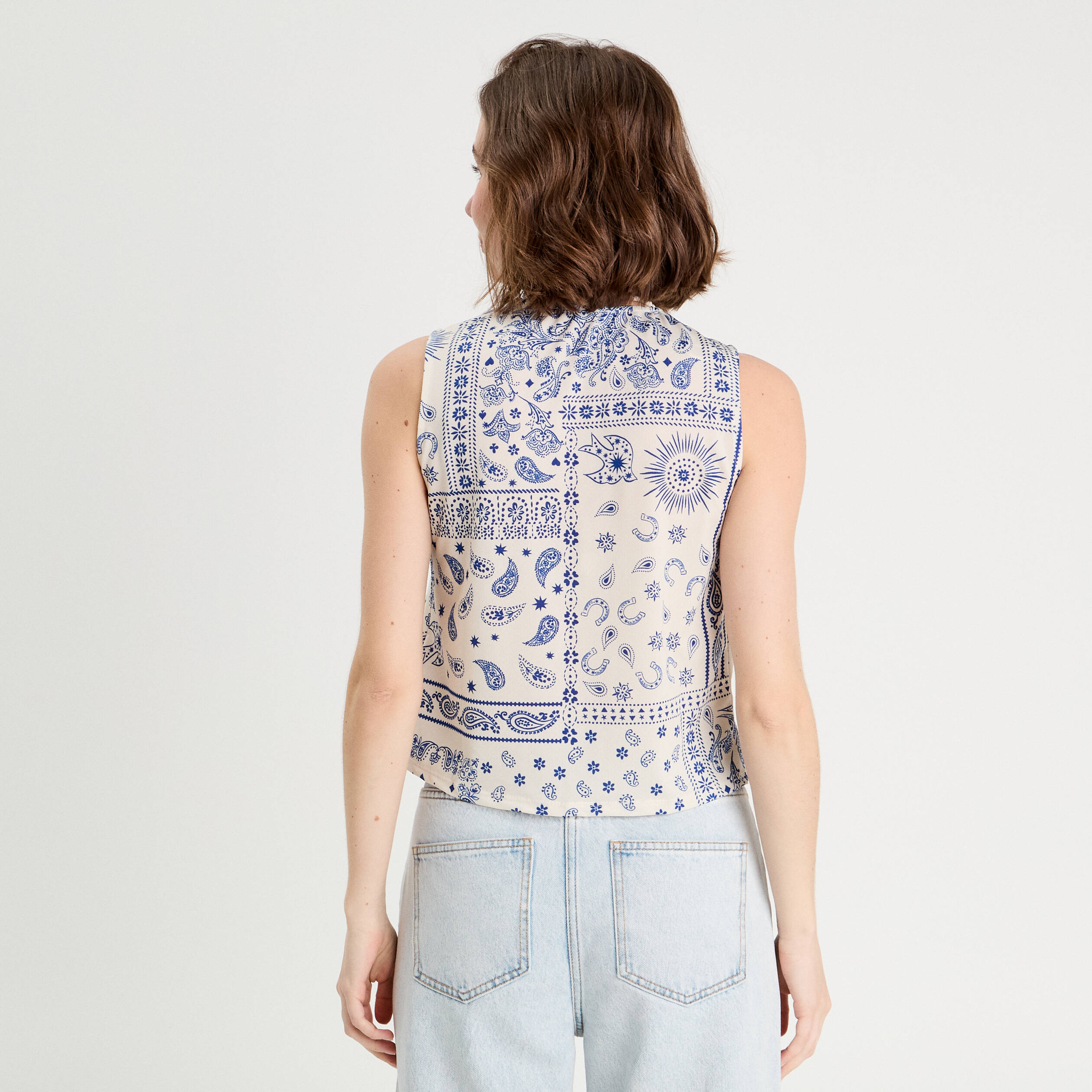 Blouse nou&eacute;e sans manches blanc femme